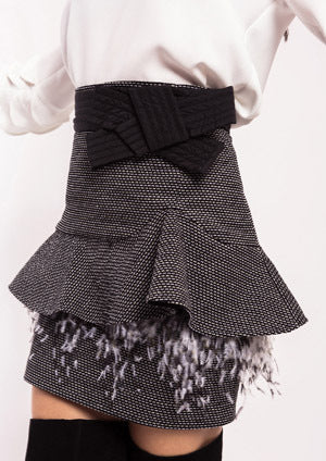 Falda ALBA CONDE jaspeada con volante en cadera