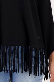 Poncho MONARI con flecos color negro