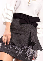 Falda ALBA CONDE jaspeada con volante en cadera