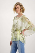 Blusa semitransparente con estampado Monari