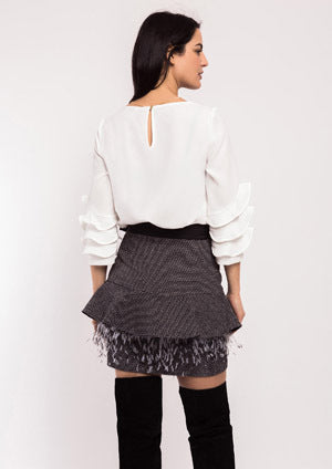 Falda ALBA CONDE jaspeada con volante en cadera