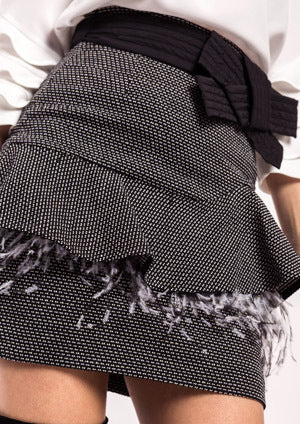 Falda ALBA CONDE jaspeada con volante en cadera