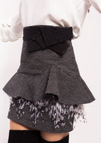 Falda ALBA CONDE jaspeada con volante en cadera